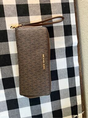 Michael Kors Brown Monogram Zip Wristlet with Gold Hardware
